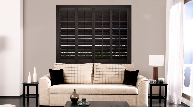 Destin living room with black shutters.